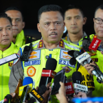 peran polisi lalu lintas dalam mengatur arus mudik